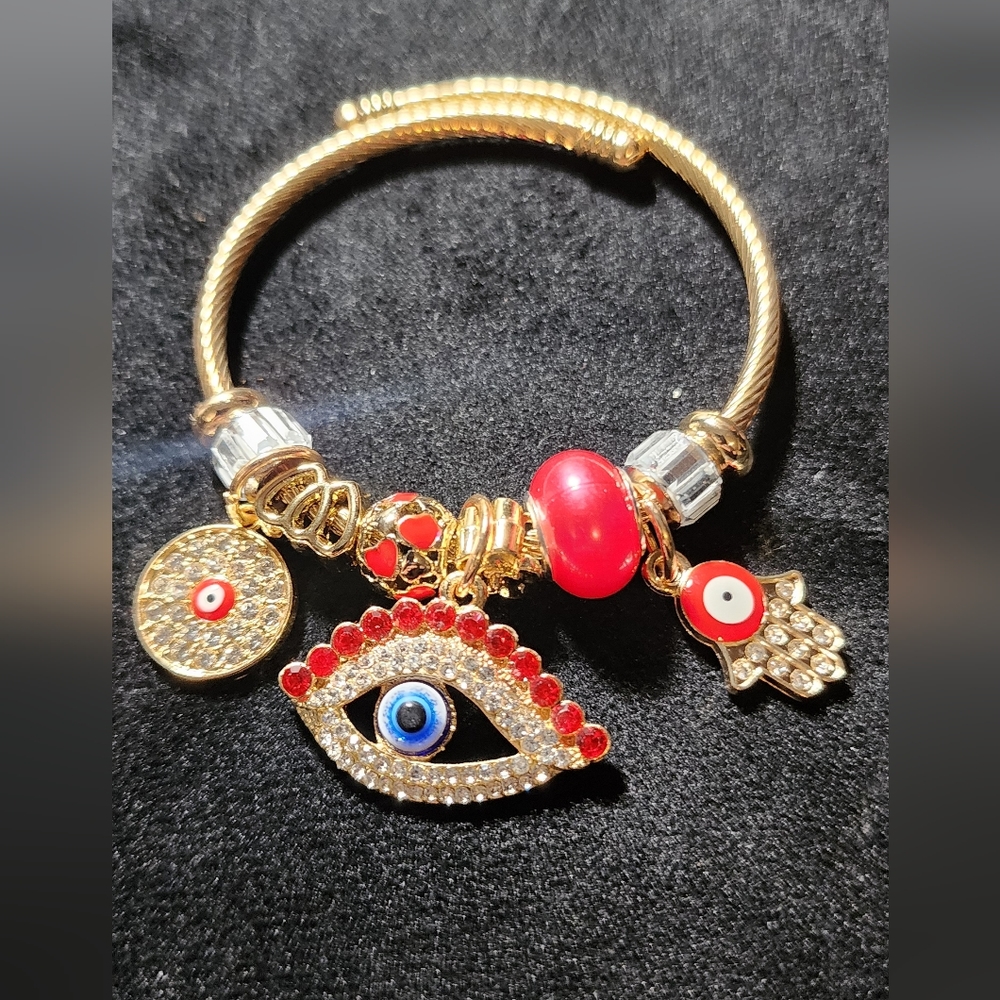 GOLD STAINLESS STEEL TWIST CHARM BRACELET